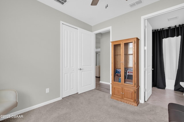 500 Barefoot Life Ln, Daytona Beach, FL 32124 - carpeted bedroom featuring a closet and ceiling fan