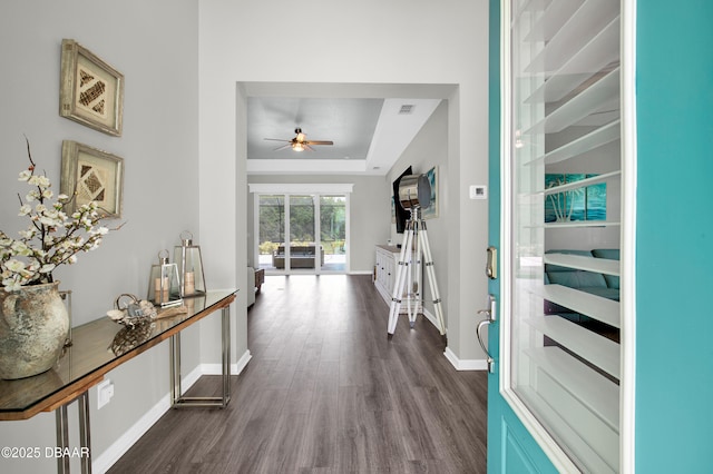 500 Barefoot Life Ln, Daytona Beach, FL 32124 - corridor featuring a raised ceiling and dark wood-style floors
