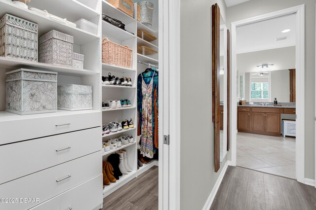 500 Barefoot Life Ln, Daytona Beach, FL 32124 - spacious closet with light wood finished floors
