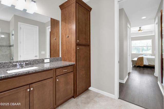 500 Barefoot Life Ln, Daytona Beach, FL 32124 - full bathroom with vanity, a ceiling fan, tiled shower, and connected bathroom