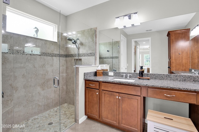 500 Barefoot Life Ln, Daytona Beach, FL 32124 - full bath featuring a shower stall, plenty of natural light, vanity, and tile patterned floors