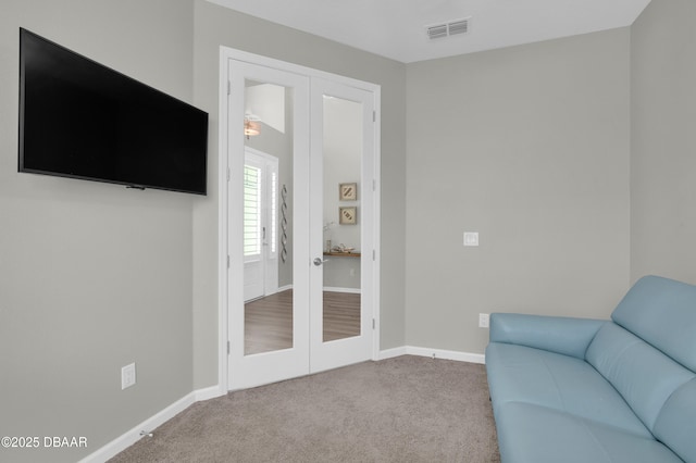 500 Barefoot Life Ln, Daytona Beach, FL 32124 - living area featuring french doors and carpet flooring