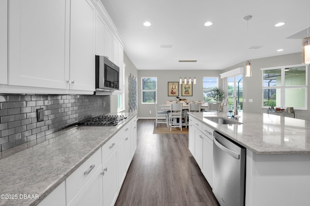 500 Barefoot Life Ln, Daytona Beach, FL 32124 - kitchen featuring stainless steel appliances, dark wood-style floors, tasteful backsplash, white cabinetry, and recessed lighting