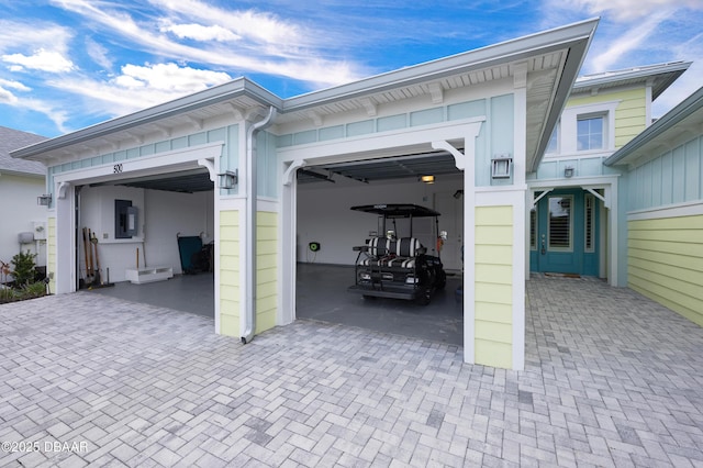 500 Barefoot Life Ln, Daytona Beach, FL 32124 - garage featuring decorative driveway