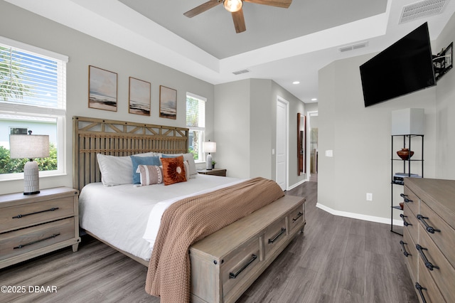 500 Barefoot Life Ln, Daytona Beach, FL 32124 - bedroom featuring wood finished floors, recessed lighting, ceiling fan, and a tray ceiling