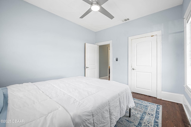 401 N Oleander Ave, Daytona Beach, FL 32118 - bedroom with wood finished floors, a ceiling fan, and baseboards