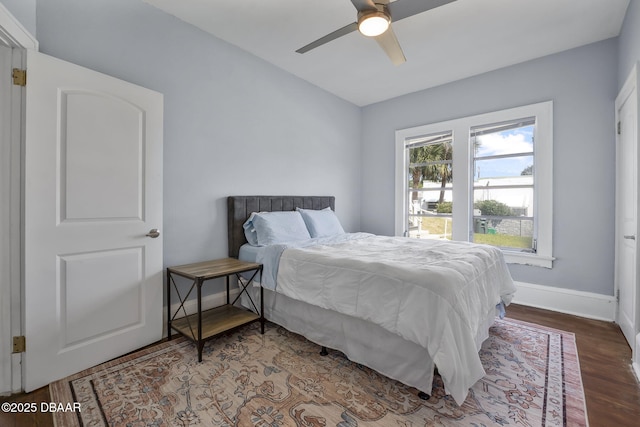 401 N Oleander Ave, Daytona Beach, FL 32118 - bedroom featuring wood finished floors, baseboards, and ceiling fan