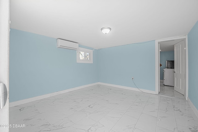 401 N Oleander Ave, Daytona Beach, FL 32118 - unfurnished room featuring a wall mounted air conditioner, light marble finish flooring, baseboards, and washer / clothes dryer