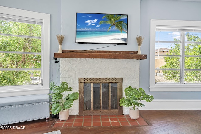 401 N Oleander Ave, Daytona Beach, FL 32118 - detailed view of wood finished floors, a fireplace with flush hearth, and baseboards