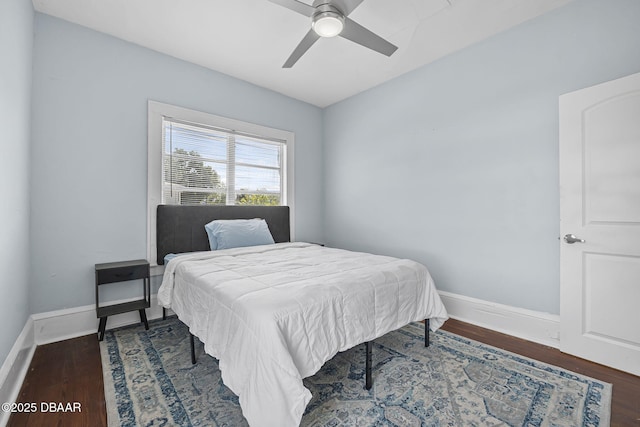 401 N Oleander Ave, Daytona Beach, FL 32118 - bedroom with wood finished floors, baseboards, and a ceiling fan