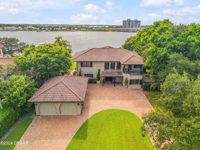 birds eye view of property with a water view