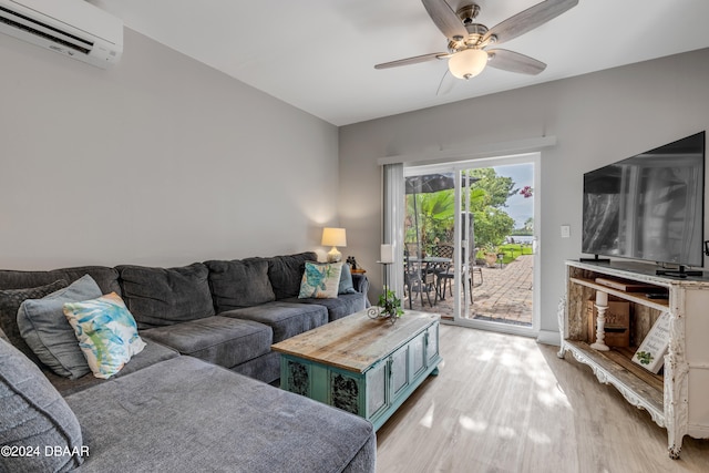 living room featuring ceiling fan, light hardwood / wood-style floors, and a wall mounted AC