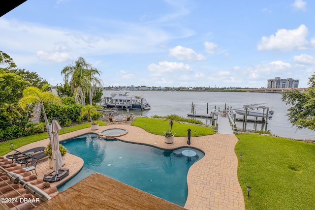 view of pool featuring an in ground hot tub, a patio area, a yard, a dock, and a water view