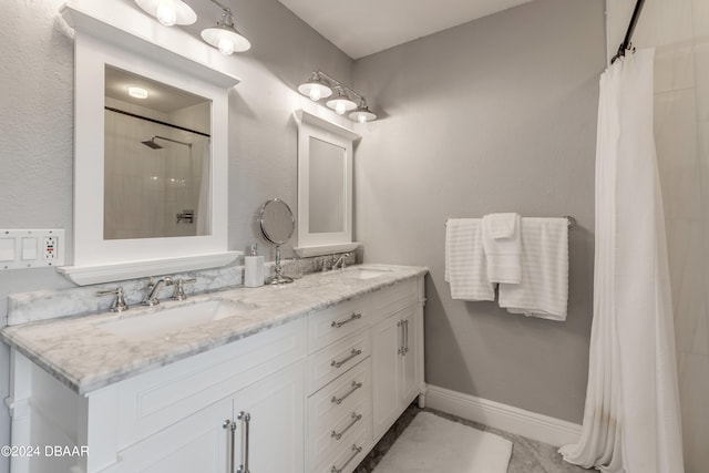 bathroom featuring curtained shower, vanity, and tile patterned floors