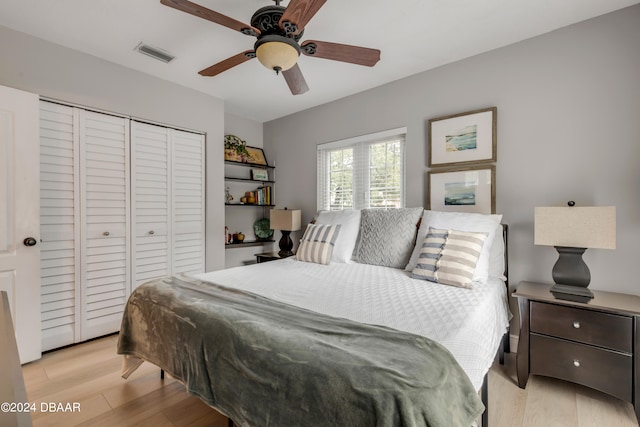 bedroom featuring a closet, ceiling fan, and light hardwood / wood-style floors