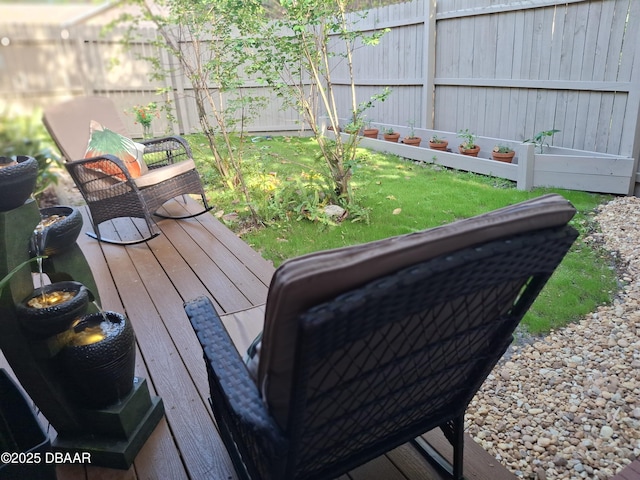deck with fence and a yard