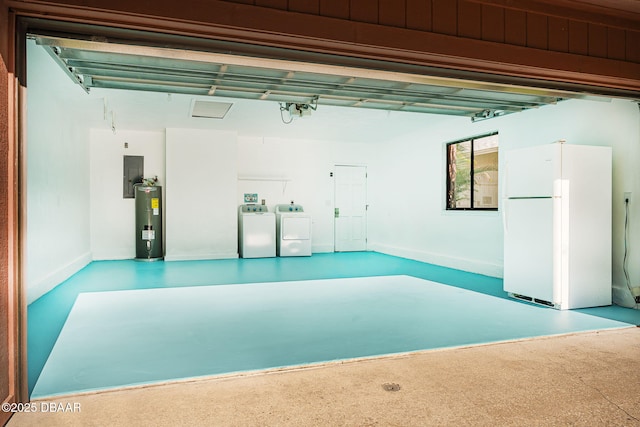 garage with electric water heater, freestanding refrigerator, washing machine and clothes dryer, electric panel, and baseboards