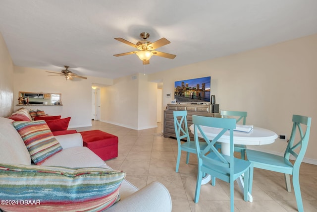 tiled living room with ceiling fan