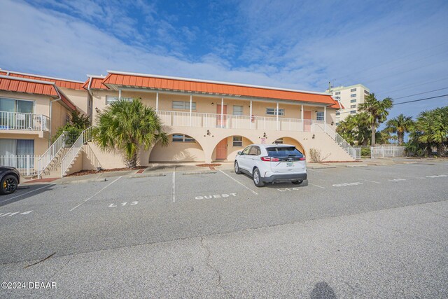 view of front of home with a balcony