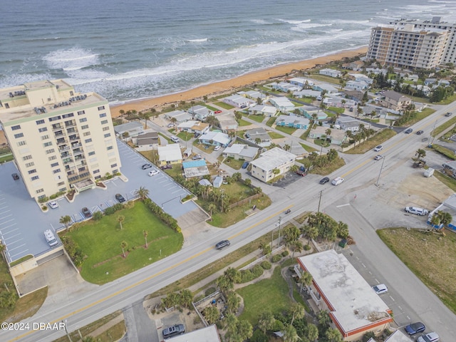 bird's eye view with a view of the beach and a water view