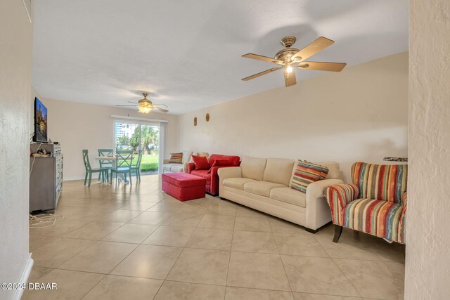 tiled living room featuring ceiling fan