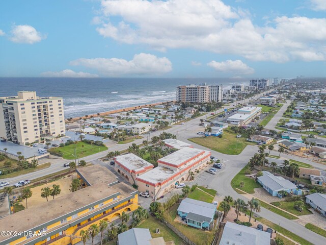 bird's eye view featuring a water view and a view of the beach