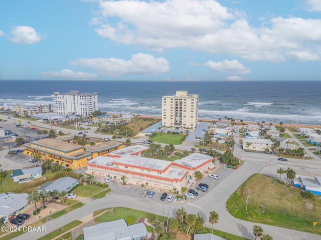 aerial view featuring a water view and a beach view