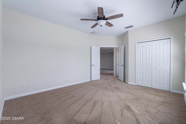 133 Wood Stork Ln, Palm Coast, FL 32164 - unfurnished bedroom featuring carpet floors, baseboards, a closet, and ceiling fan