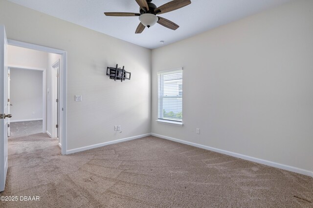 133 Wood Stork Ln, Palm Coast, FL 32164 - spare room with carpet, baseboards, and ceiling fan