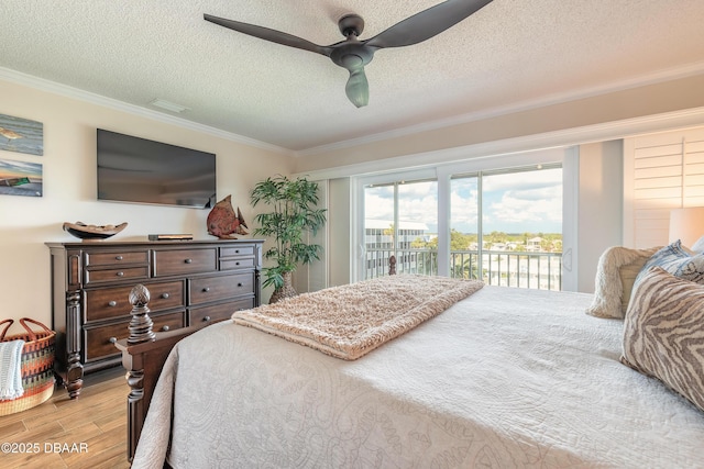 bedroom with a textured ceiling, access to outside, light wood-style flooring, and crown molding