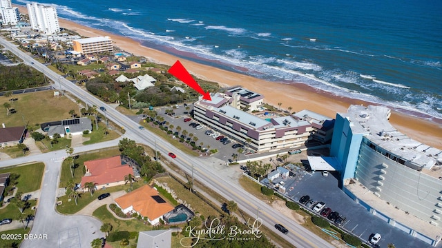 aerial view with a view of the beach and a water view