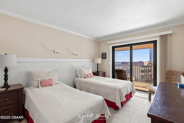 bedroom with light colored carpet, ornamental molding, access to exterior, and a textured ceiling