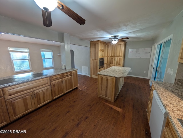 kitchen with dark wood-style floors, a ceiling fan, oven, dishwasher, and a center island