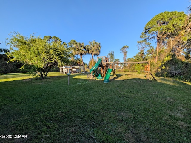 community play area featuring a lawn