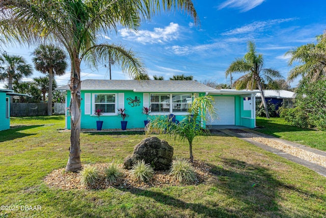 ranch-style home with a garage and a front yard