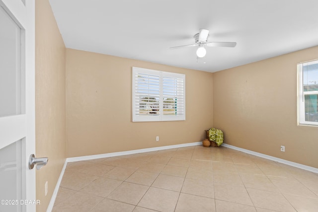 tiled empty room with ceiling fan