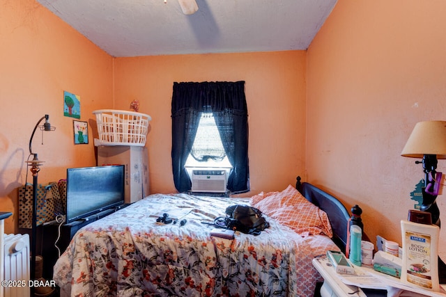 326 Jefferson St, Daytona Beach, FL 32114 - bedroom featuring radiator heating unit, cooling unit, and a ceiling fan