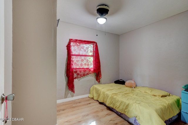 326 Jefferson St, Daytona Beach, FL 32114 - bedroom with wood finished floors, baseboards, and a ceiling fan