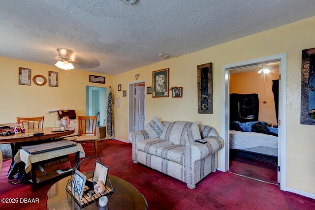 326 Jefferson St, Daytona Beach, FL 32114 - carpeted living area with a ceiling fan, baseboards, and a textured ceiling