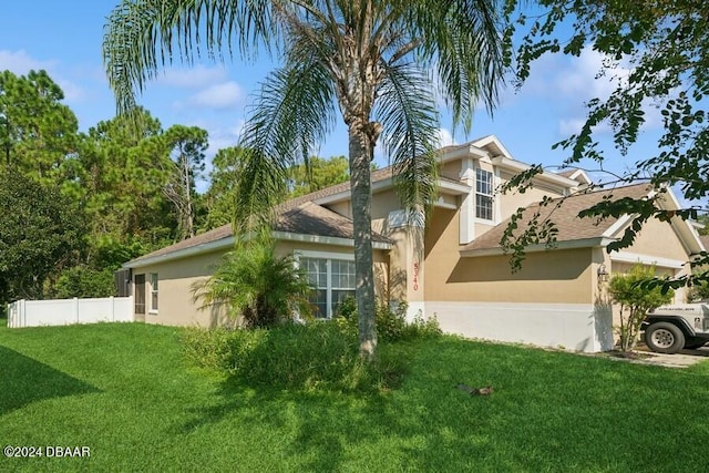 view of front of home with a front lawn