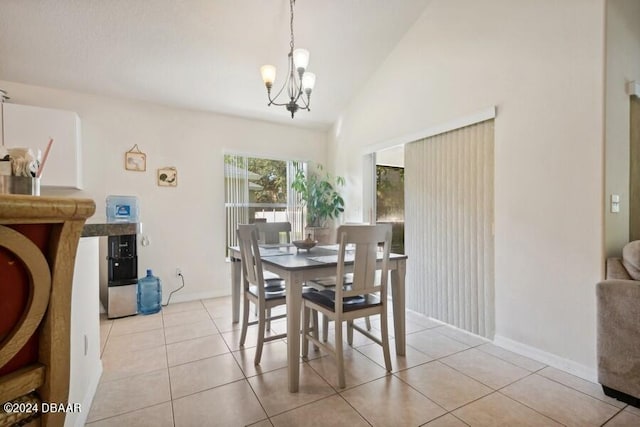 dining room featuring light tile patterned floors, high vaulted ceiling, and a notable chandelier