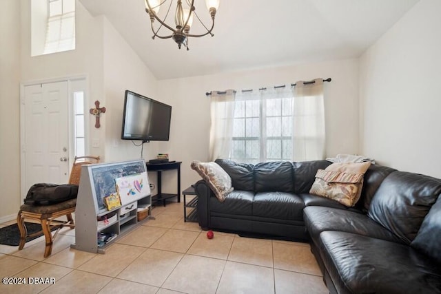 living room featuring a notable chandelier, light tile patterned floors, and lofted ceiling