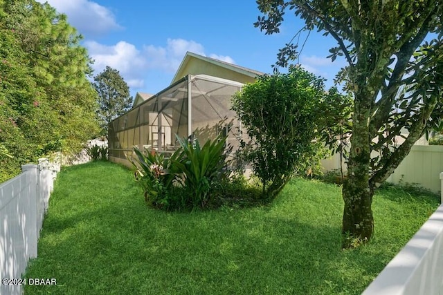 view of yard with a lanai