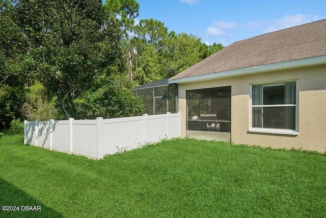 view of yard featuring a sunroom