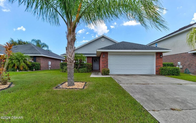 ranch-style home with a garage and a front yard