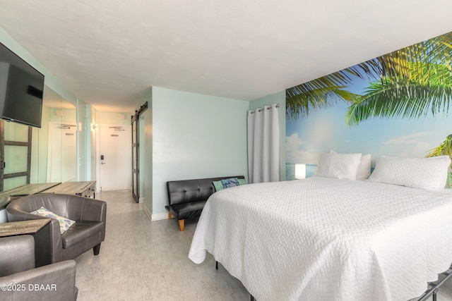 bedroom featuring baseboards and light wood-type flooring