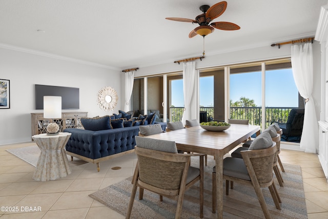 dining area featuring light tile patterned floors, crown molding, and a wealth of natural light