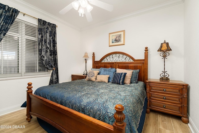 bedroom featuring ceiling fan, light wood-type flooring, and ornamental molding