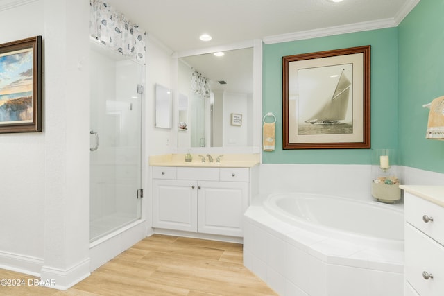 bathroom with separate shower and tub, hardwood / wood-style floors, vanity, and ornamental molding