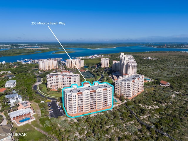 birds eye view of property with a water view